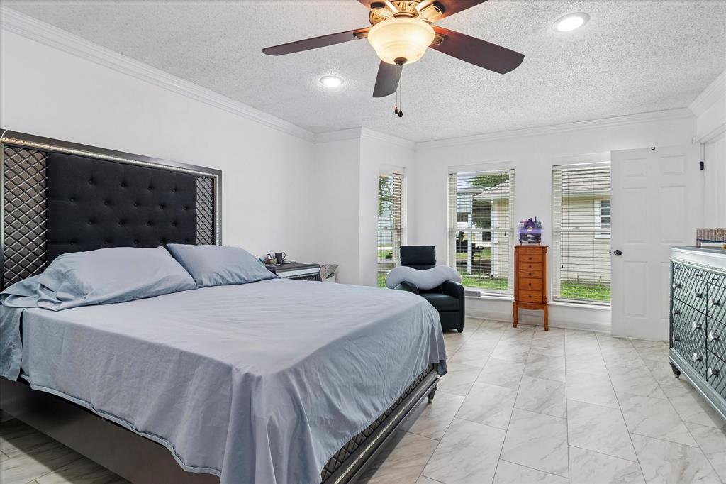 3007 McReynolds Road Sanger, TX 76266 - Photo 9 of 39 Spacious bedroom featuring light-toned tile flooring, recessed lighting, and a ceiling fan with integrated illumination