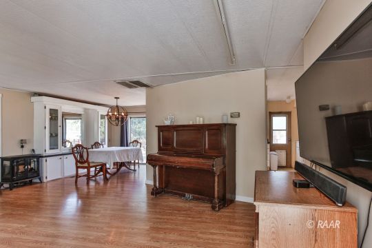 4512 Stark Street Ridgecrest, CA 93555 - Photo 2 of 22 a living room with furniture and a flat screen tv
