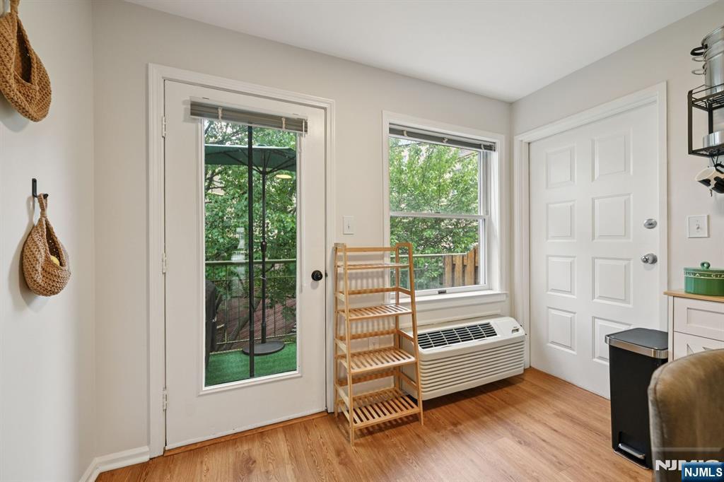 50 Pine Street, Unit 206 Montclair, NJ 07042 - Photo 14 of 23 a view of an empty room with a window and wooden floor