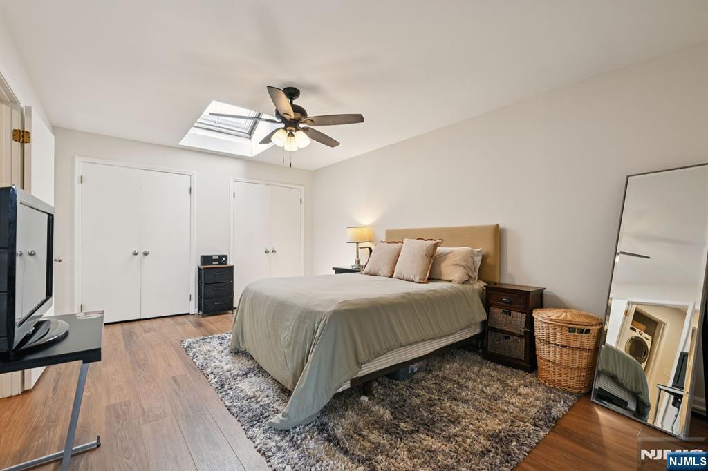 50 Pine Street, Unit 206 Montclair, NJ 07042 - Photo 17 of 23 a spacious bedroom with a bed and a flat screen tv