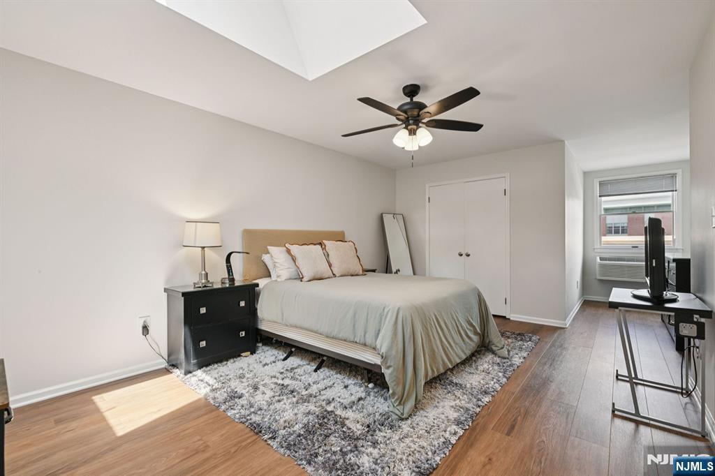 50 Pine Street, Unit 206 Montclair, NJ 07042 - Photo 18 of 23 a bedroom with a bed and a ceiling fan