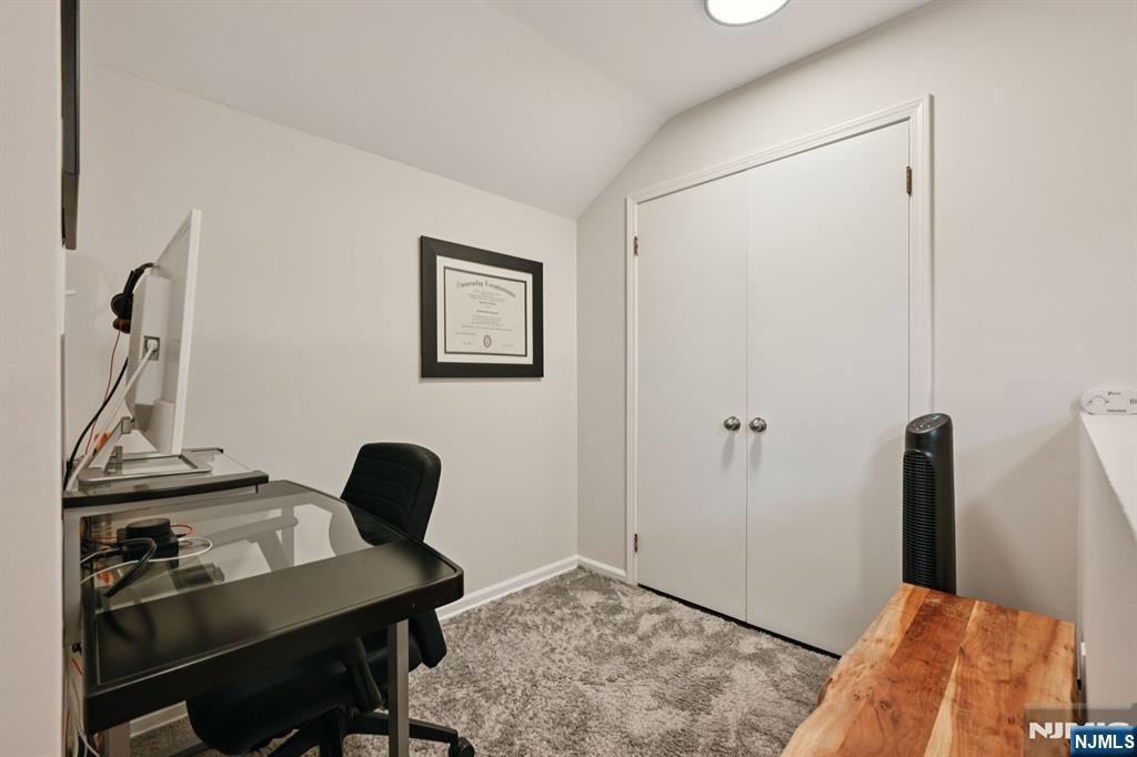 50 Pine Street, Unit 206 Montclair, NJ 07042 - Photo 20 of 23 a view of a workspace with furniture and a gate