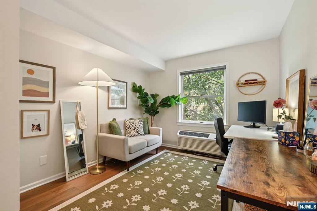 50 Pine Street, Unit 206 Montclair, NJ 07042 - Photo 9 of 23 a living room with furniture and a flat screen tv