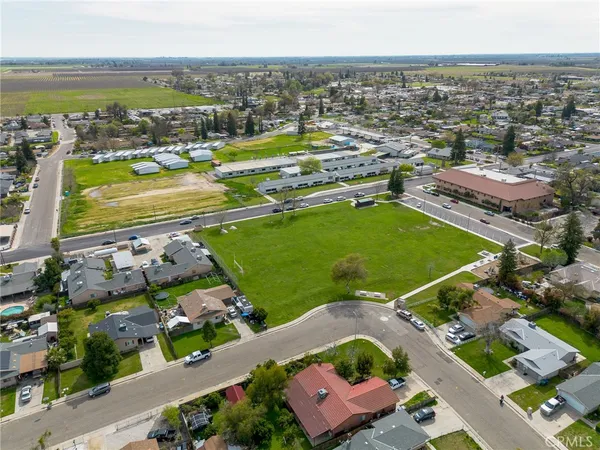 an aerial view of a city with lawn chairs