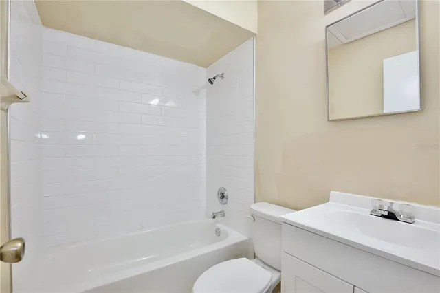 a bathroom with a bathtub and a sink