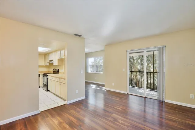 a view of a kitchen cabinets and wooden floor