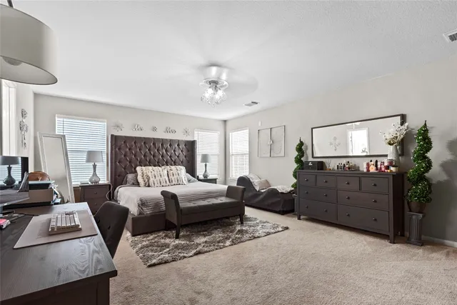 a living room with furniture and a dresser