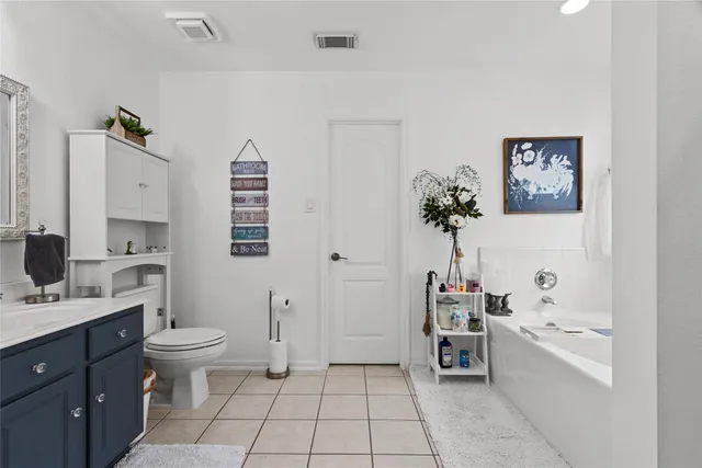 a bathroom with a sink a toilet and bathtub