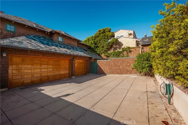 a kitchen with stainless steel appliances granite countertop a sink and a refrigerator
