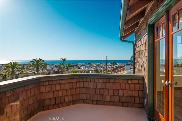 a kitchen with stainless steel appliances granite countertop a sink a stove and a wooden floors