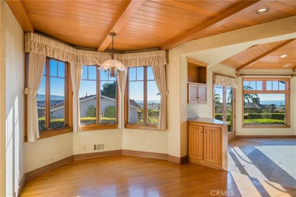 a view of a door and a window