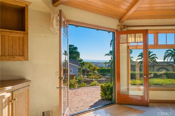a view of a kitchen with a sink and cabinets