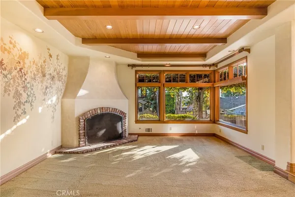 a large bedroom with a large bed and a dresser