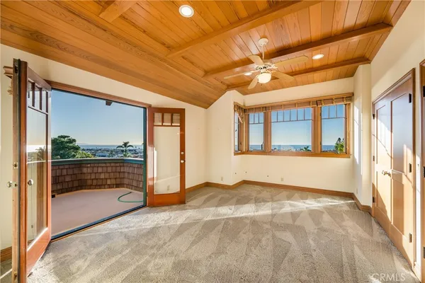 a bathroom with a granite countertop sink toilet a mirror a vanity and shower