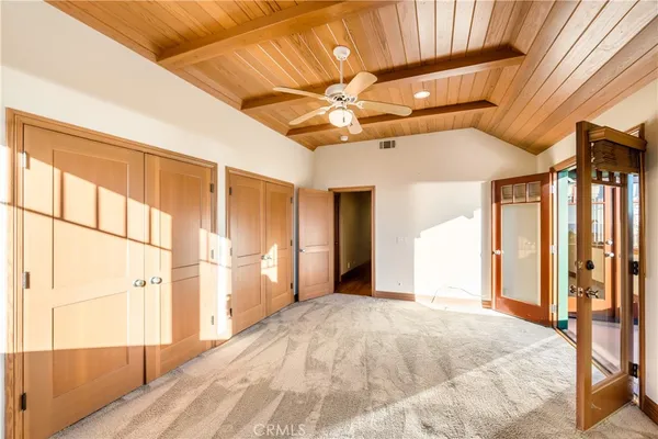 a bathroom with a sink mirror and toilet