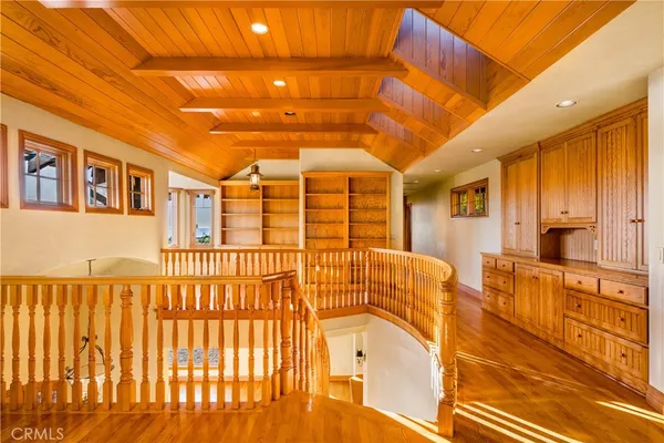 a view of a house with a yard and potted plants