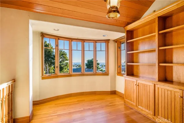 a view of an empty room with a balcony