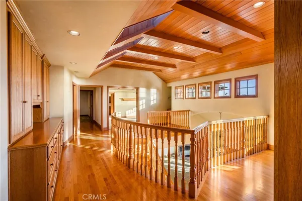 a kitchen with stainless steel appliances granite countertop a stove and a wooden floors