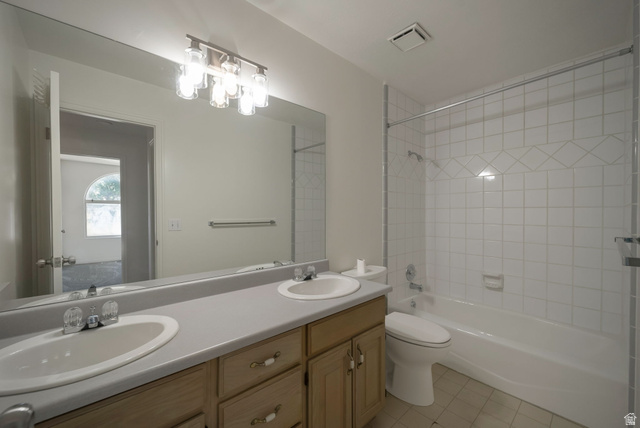 11922 Bluff View Drive Sandy, UT 84092 - Photo 13 of 30 Bathroom with double vanity, shower / bathtub combination, and light tile patterned floors