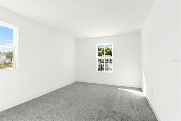 an empty room with windows