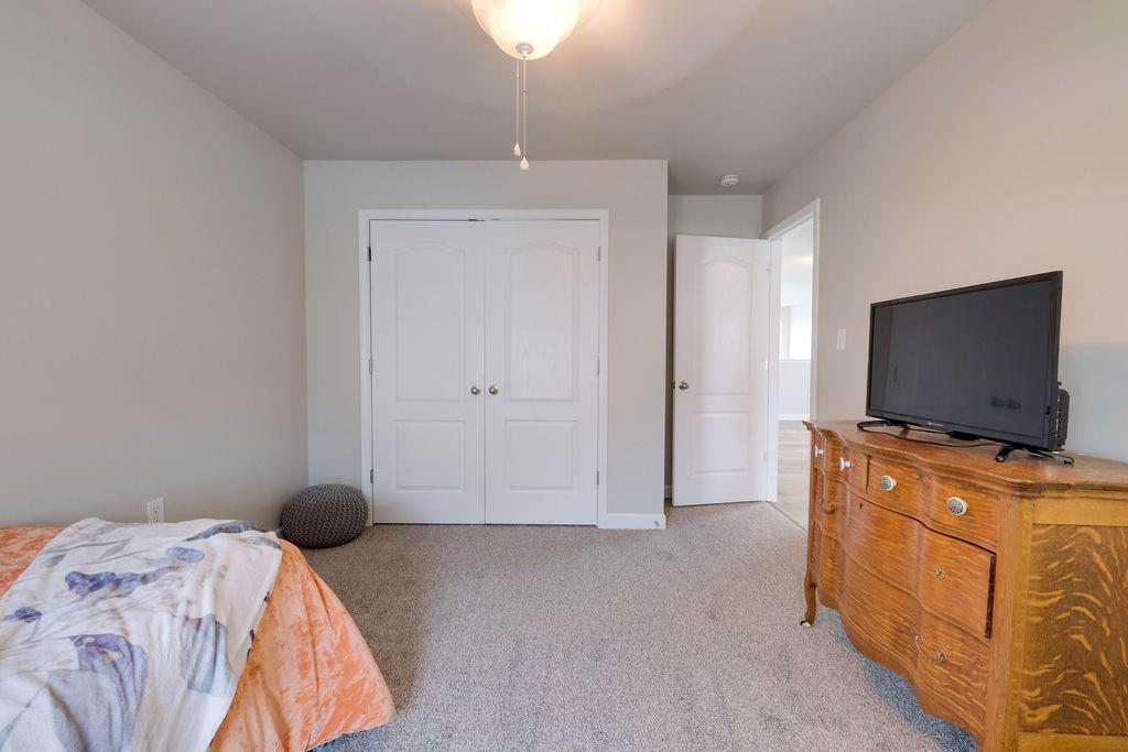 349 Sandy Spring Lane Clover, SC 29710 - Photo 20 of 28 a bedroom with a bed and flat screen tv