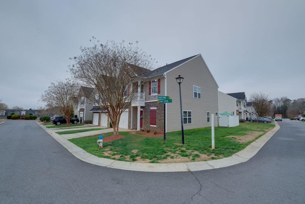 349 Sandy Spring Lane Clover, SC 29710 - Photo 2 of 28 a front view of a house with a yard