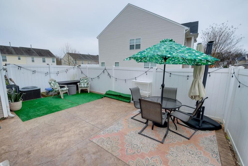 349 Sandy Spring Lane Clover, SC 29710 - Photo 26 of 28 a swimming pool with outdoor seating and yard