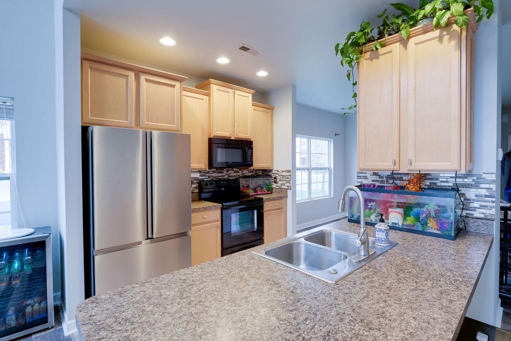 349 Sandy Spring Lane Clover, SC 29710 - Photo 6 of 28 a kitchen with stainless steel appliances granite countertop a refrigerator a stove top oven a sink and dishwasher