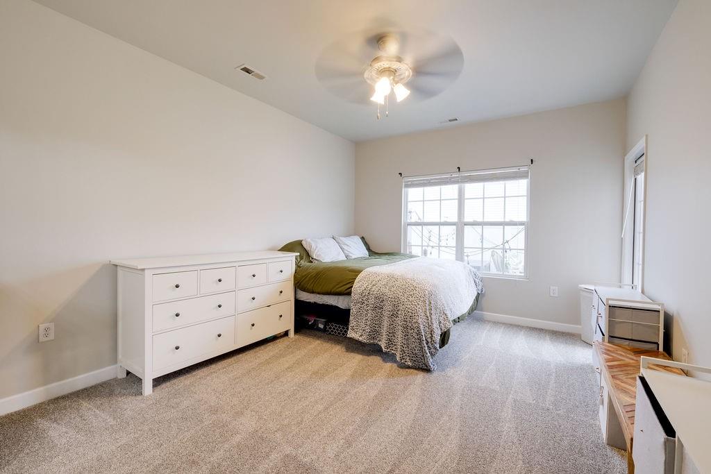 349 Sandy Spring Lane Clover, SC 29710 - Photo 10 of 28 a bedroom with a bed dresser and a window