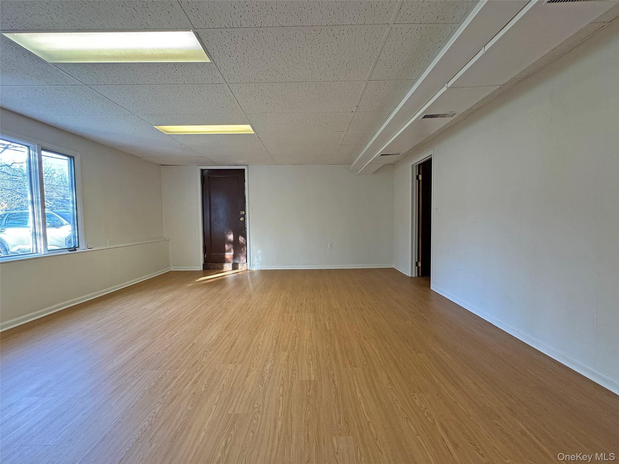 461 Pinebrook Boulevard New Rochelle, NY 10804 - Photo 21 of 32 a view of empty room with wooden floor and fan