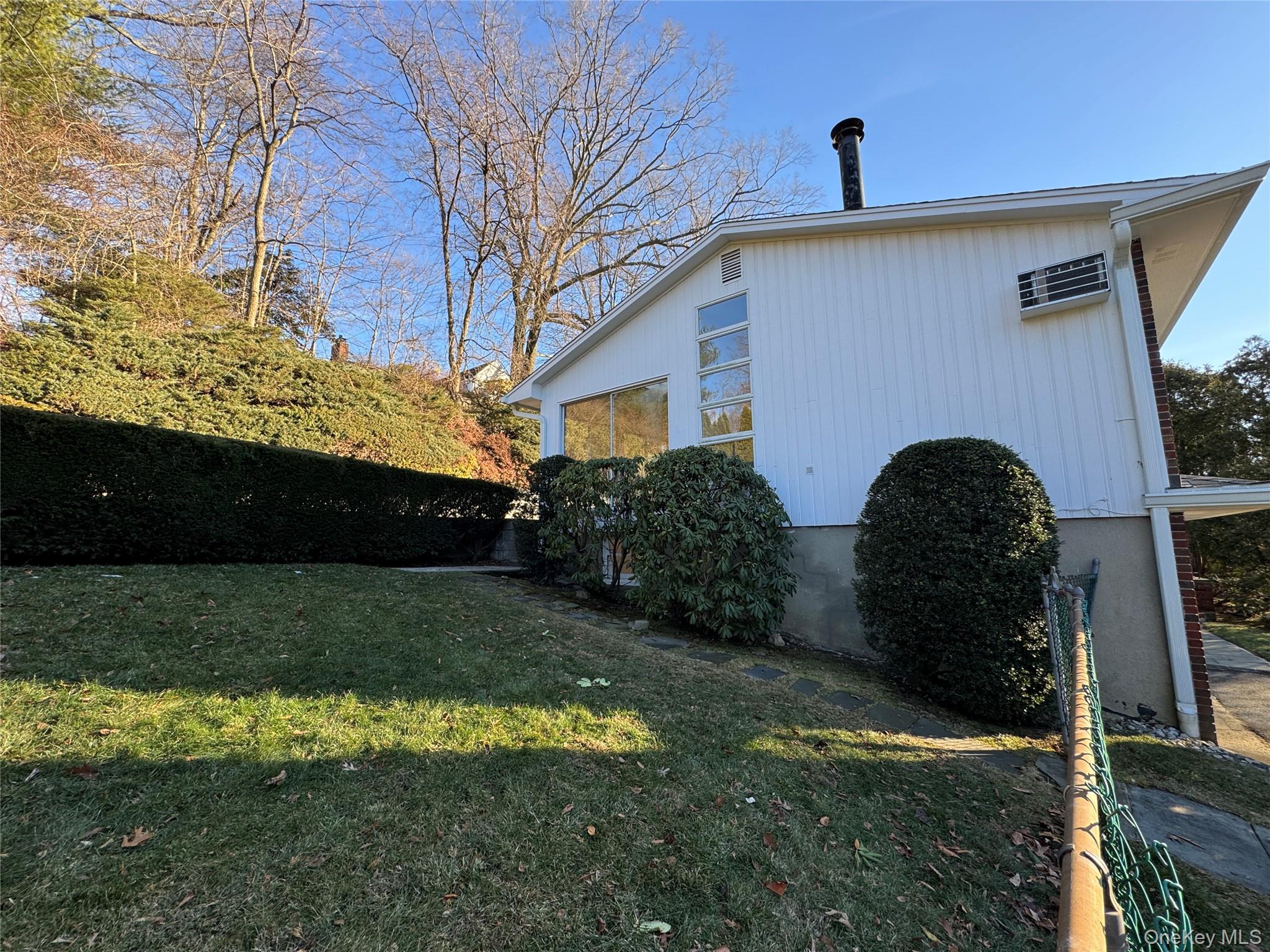461 Pinebrook Boulevard New Rochelle, NY 10804 - Photo 27 of 32 a front view of a house with a yard