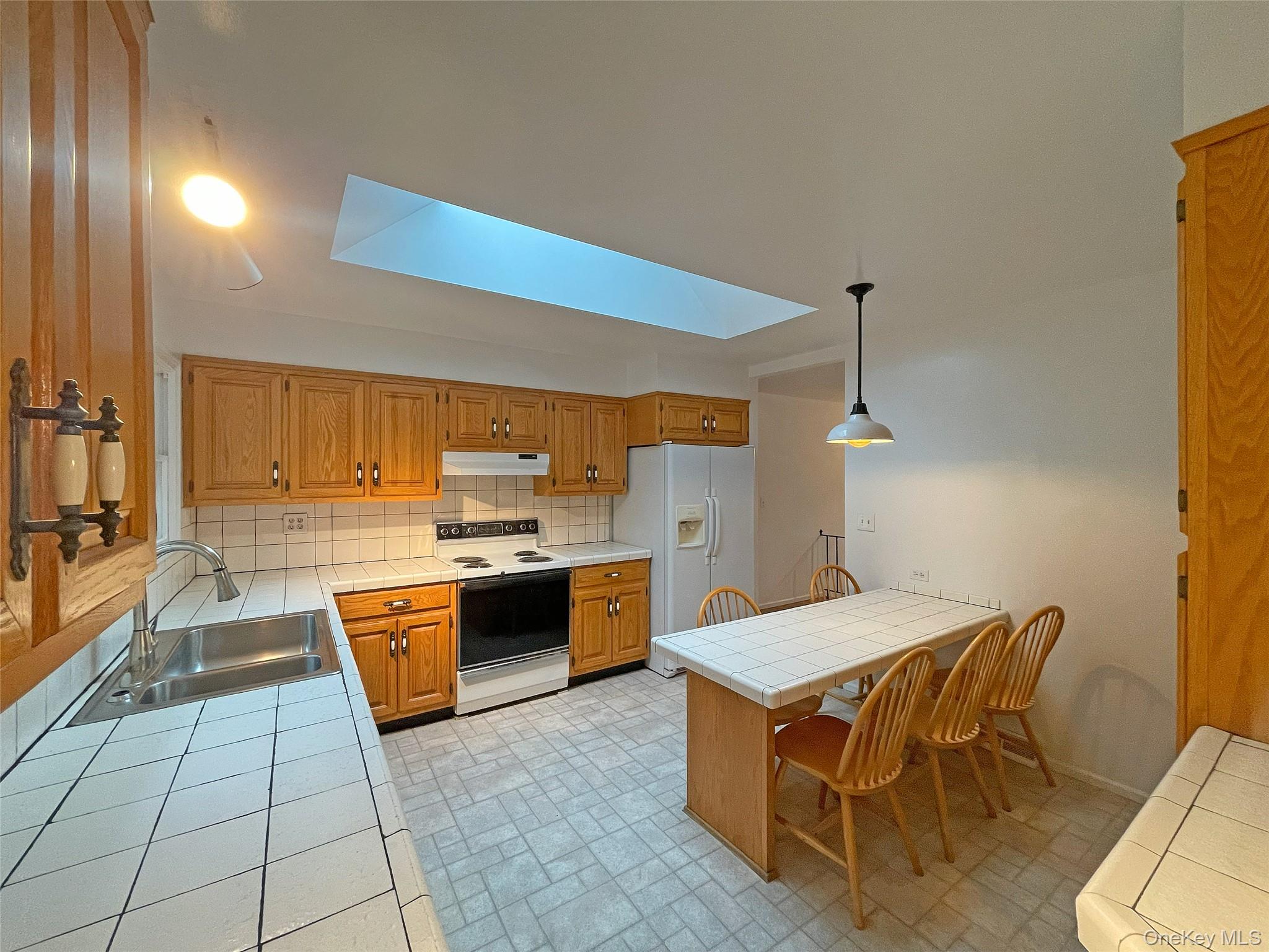 461 Pinebrook Boulevard New Rochelle, NY 10804 - Photo 8 of 32 a kitchen with a sink a counter top space and appliances