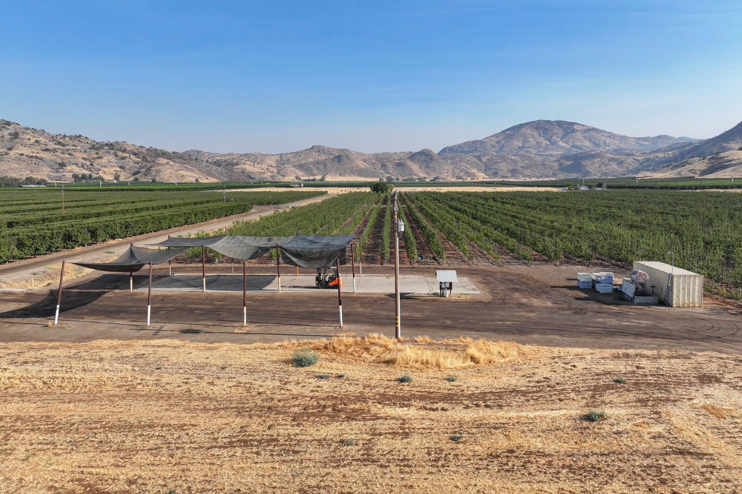 3905 South Hills Valley Road Orange Cove, CA 93646 - Photo 7 of 12 a view of a lake with a mountain