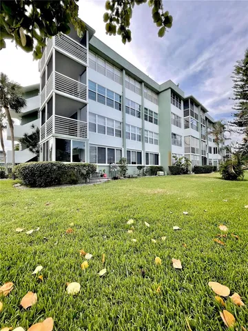 a front view of building with yard