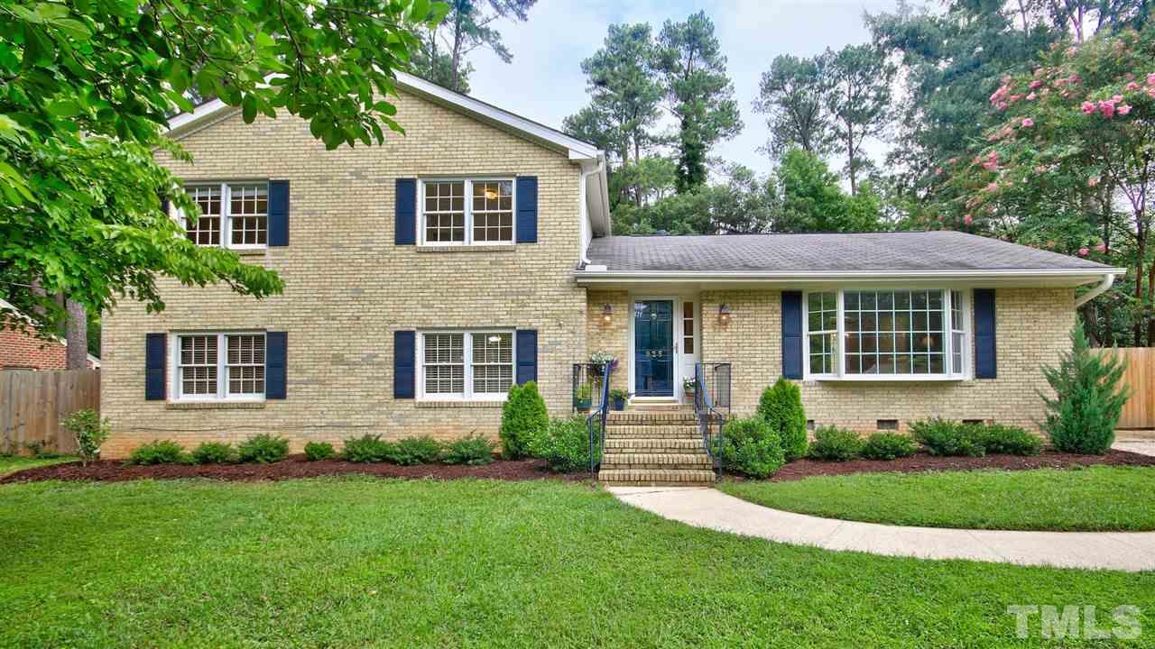 925 Pebblebrook Drive Raleigh, NC 27609 - Photo 1 of 23 a front view of a house with a yard and porch