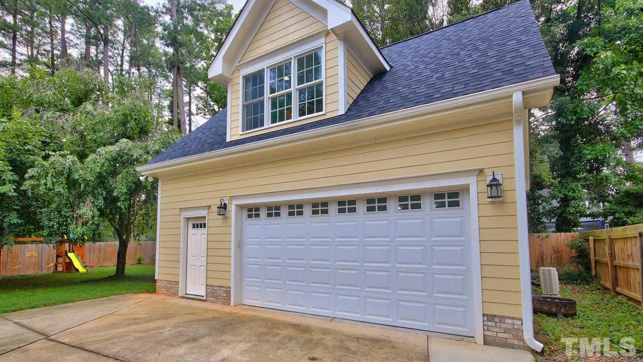 925 Pebblebrook Drive Raleigh, NC 27609 - Photo 2 of 23 a front view of a house with a yard