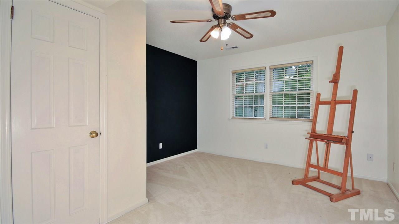 925 Pebblebrook Drive Raleigh, NC 27609 - Photo 14 of 23 an empty room with windows and fan