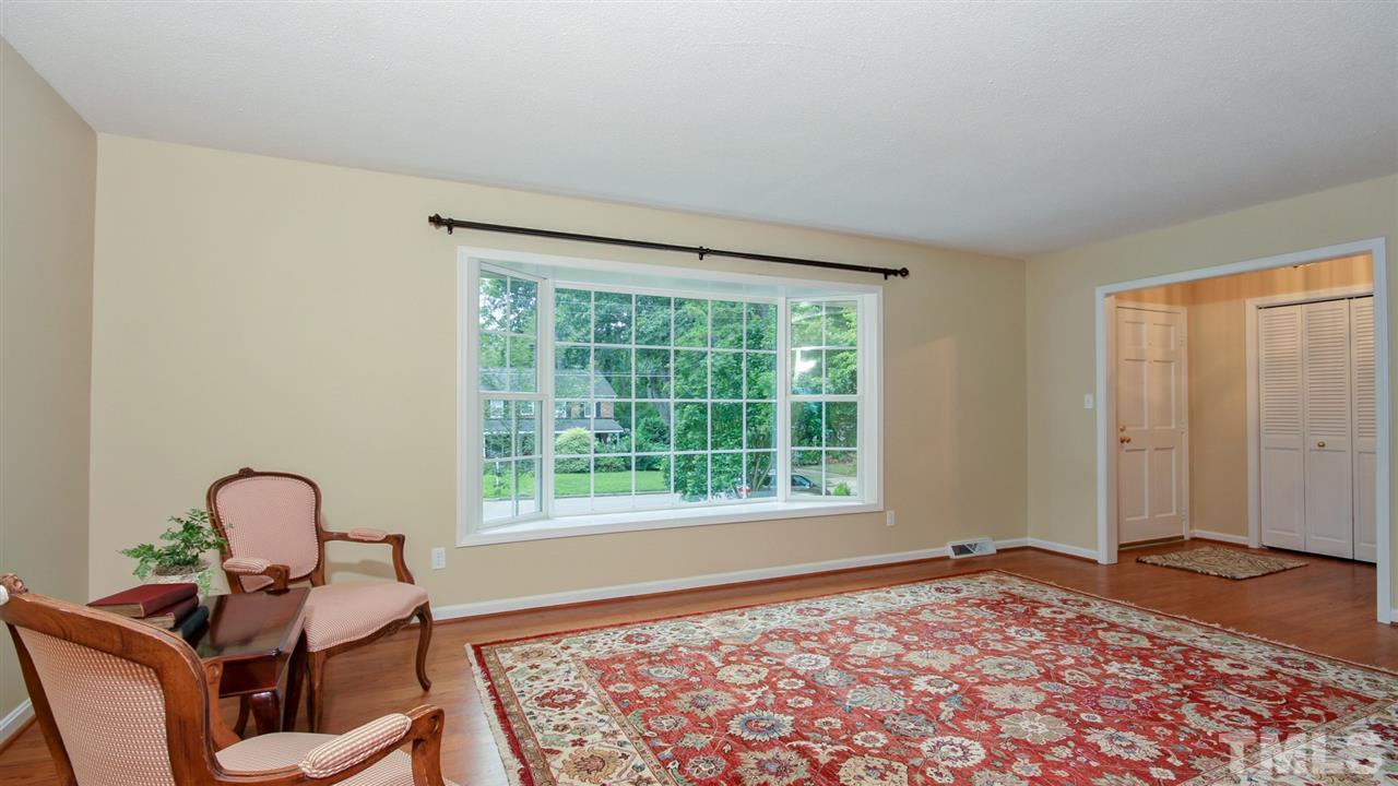 925 Pebblebrook Drive Raleigh, NC 27609 - Photo 3 of 23 a living room with furniture and a window