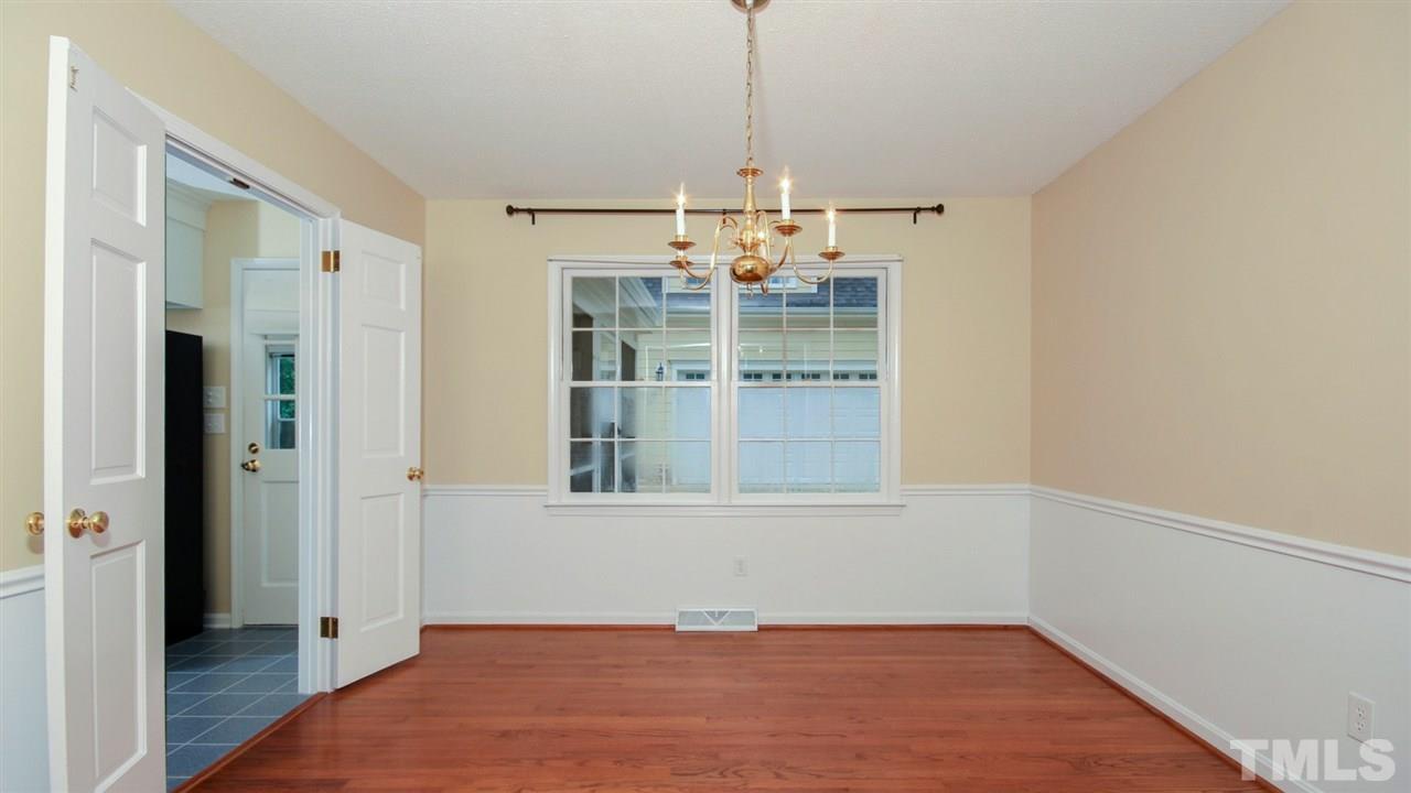 925 Pebblebrook Drive Raleigh, NC 27609 - Photo 5 of 23 a view of a room with a window and wooden floor