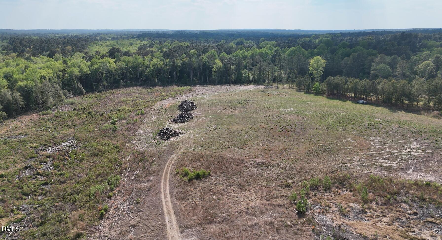 0 Lakebay Road Vass, NC 28394 - Photo 5 of 6 a view of a dry yard with trees