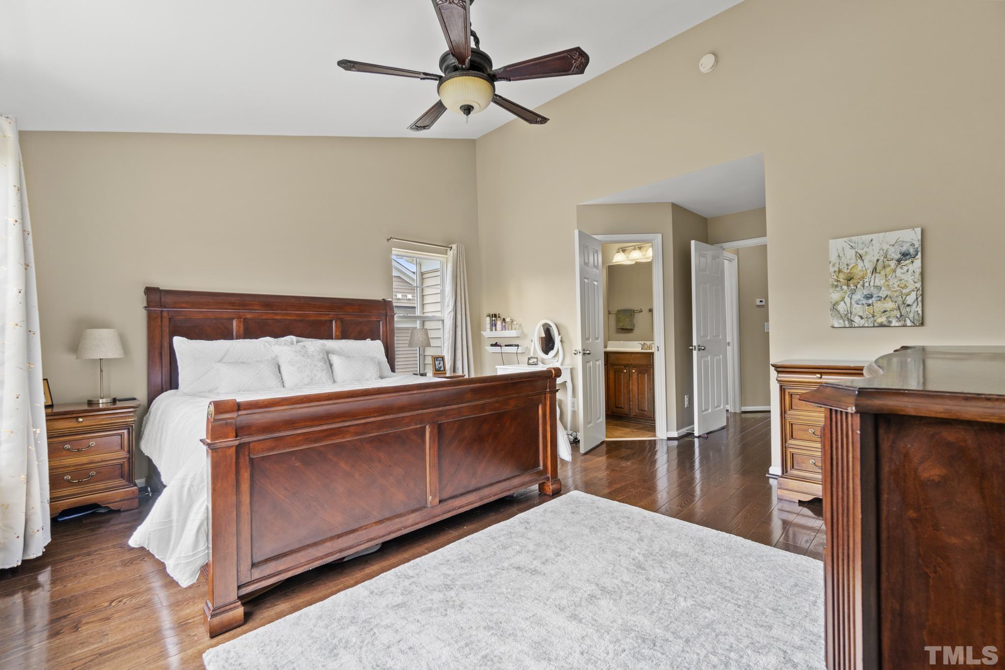 2956 Casona Way Raleigh, NC 27616 - Photo 13 of 27 a bed room with a bed and a dresser