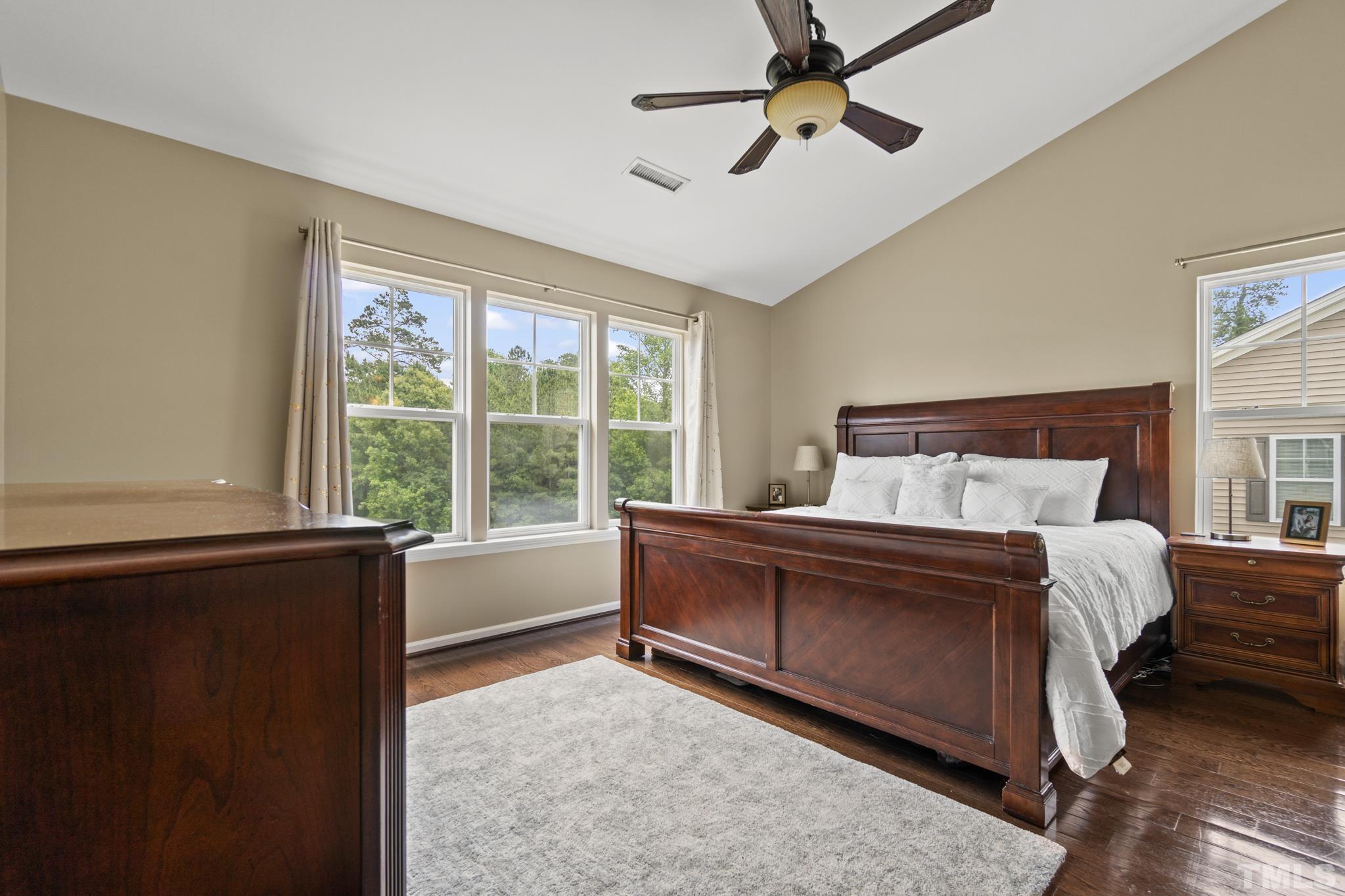 2956 Casona Way Raleigh, NC 27616 - Photo 14 of 27 a bed sitting in a bedroom next to a window