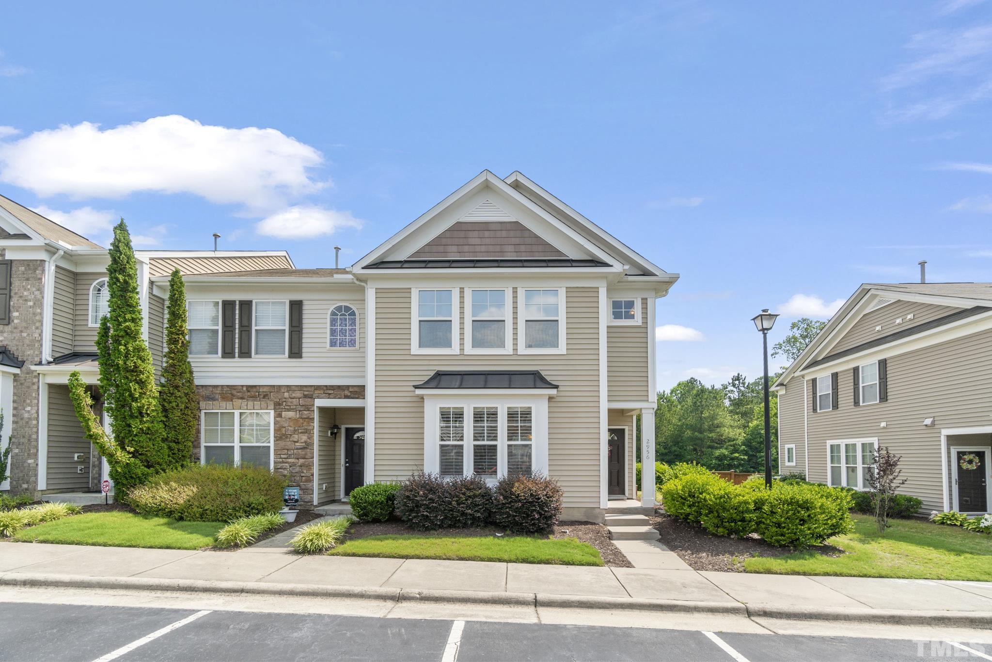 2956 Casona Way Raleigh, NC 27616 - Photo 2 of 27 a front view of a house with garden