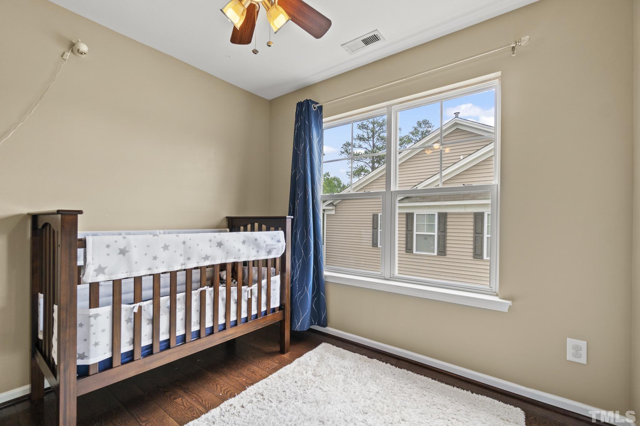 2956 Casona Way Raleigh, NC 27616 - Photo 22 of 27 a view of a bedroom with wooden floor