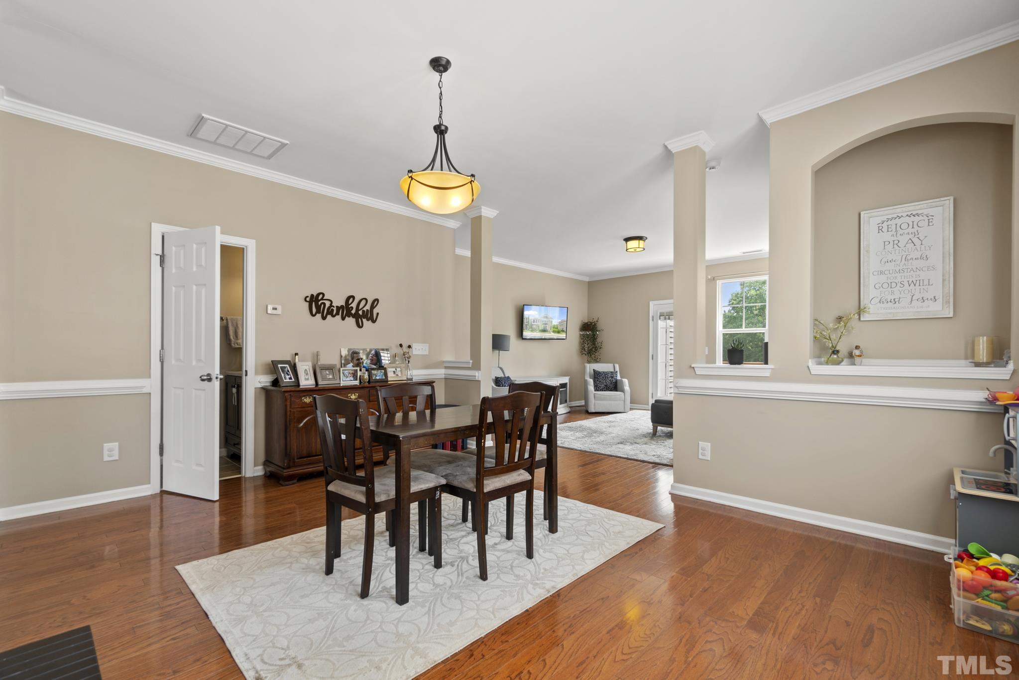 2956 Casona Way Raleigh, NC 27616 - Photo 3 of 27 a view of a dining room with furniture