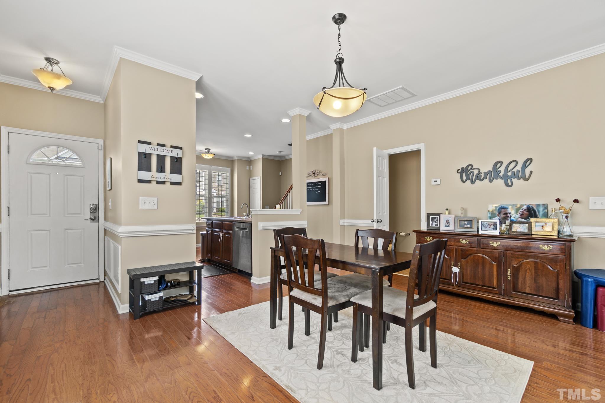 2956 Casona Way Raleigh, NC 27616 - Photo 4 of 27 a view of a dining room with furniture and wooden floor