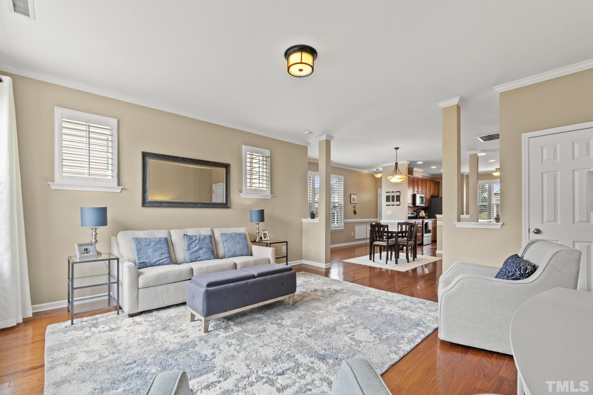 2956 Casona Way Raleigh, NC 27616 - Photo 7 of 27 a living room with furniture and a table