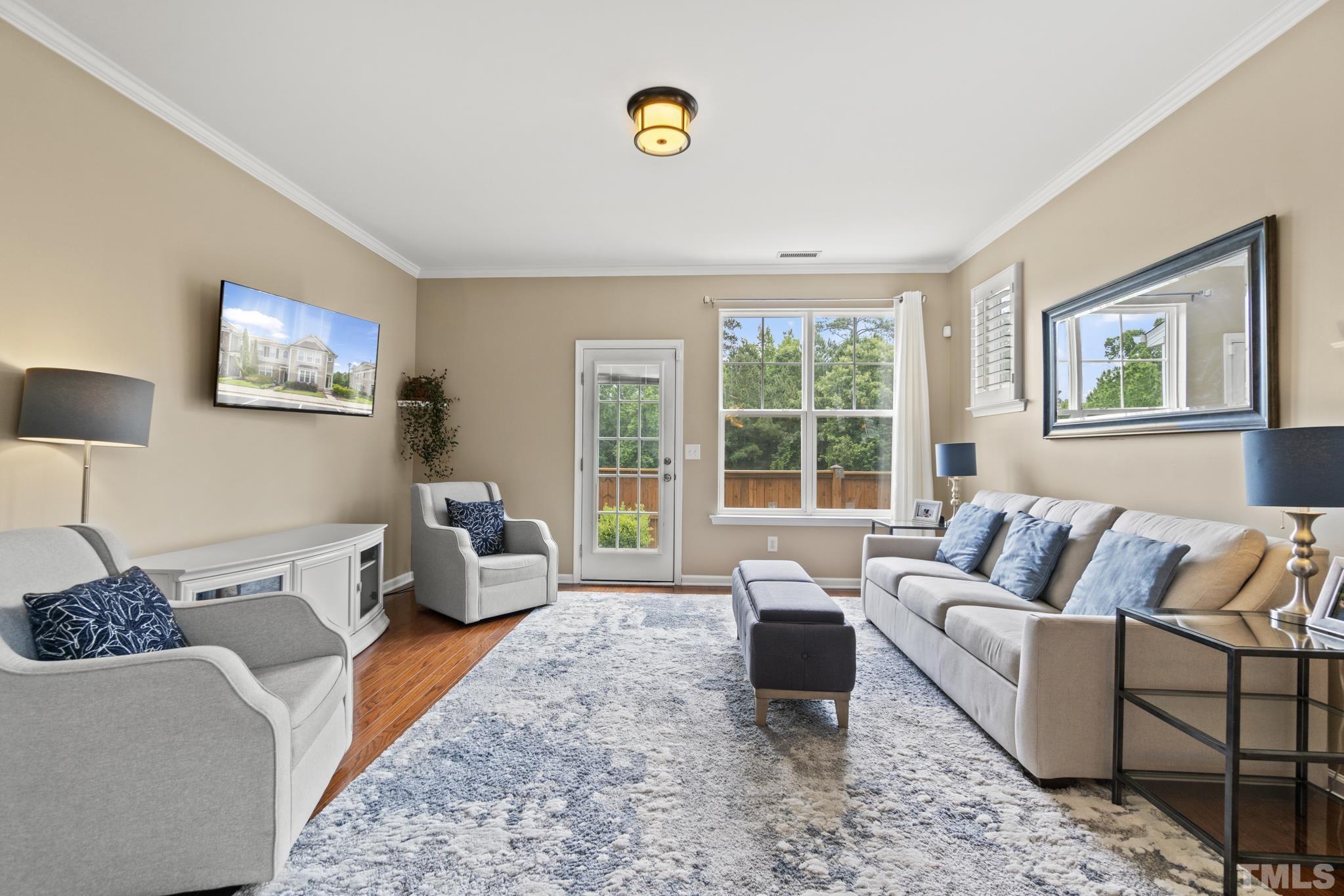 2956 Casona Way Raleigh, NC 27616 - Photo 8 of 27 a living room with furniture wooden floor and window