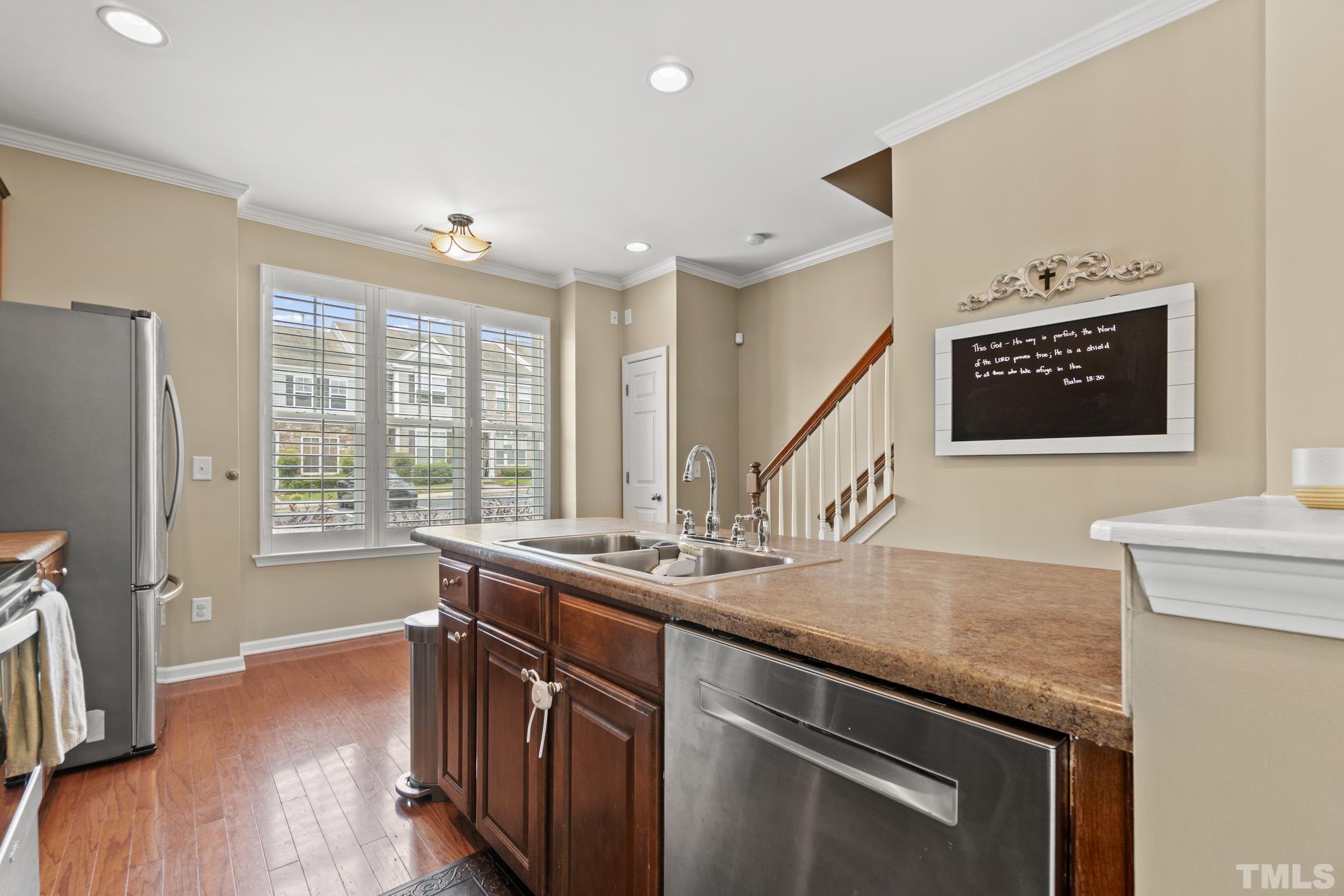 2956 Casona Way Raleigh, NC 27616 - Photo 9 of 27 a kitchen with a sink stove and refrigerator