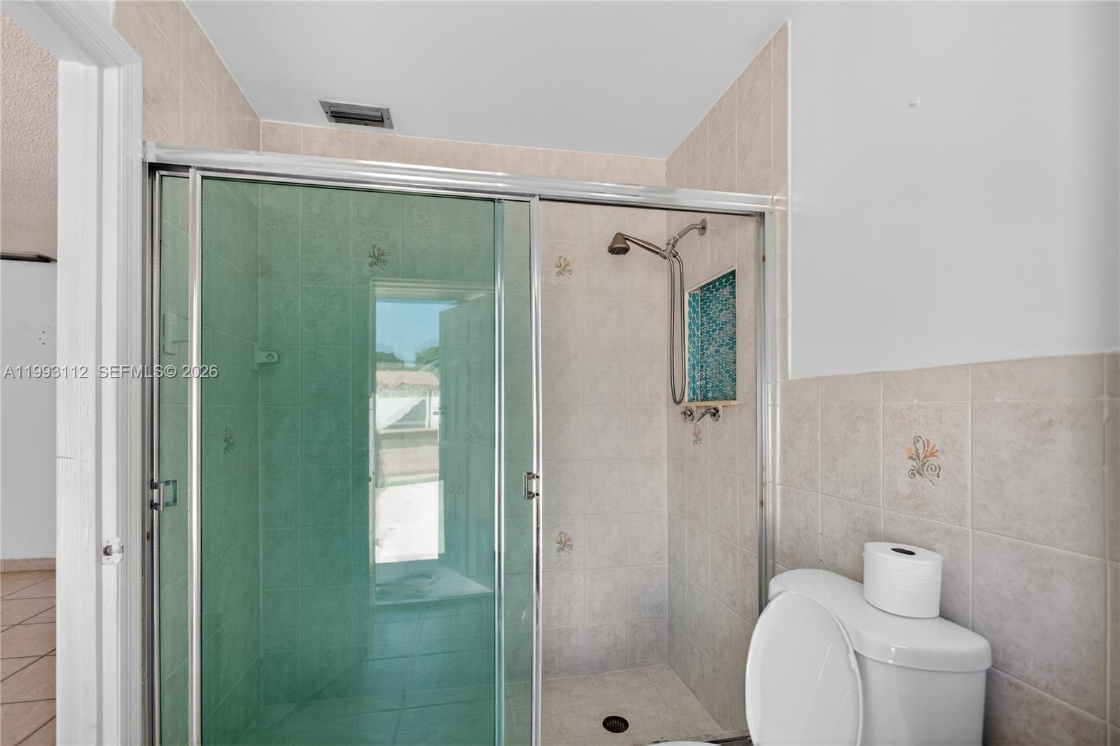 13471 Southwest 99th Terrace Miami, FL 33186 - Photo 23 of 44 a bathroom with a shower and toilet